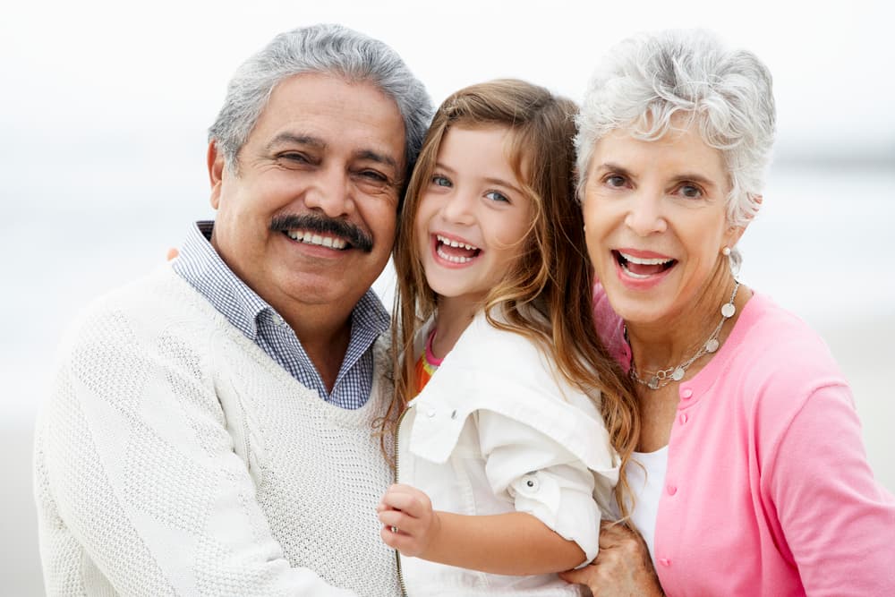 Happy multi-generational family smiling together